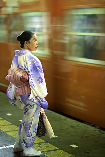 Photo of a woman in Tokyo, Japan wearing a Kimono at Shinjuku train station