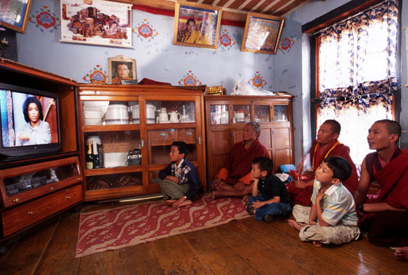 Photo of monks watching television