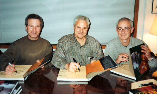 Photo of photographers Jeffrey Aaronson, Larry Price and Michael Lewis at a book signing for A Day in the Life of Africa