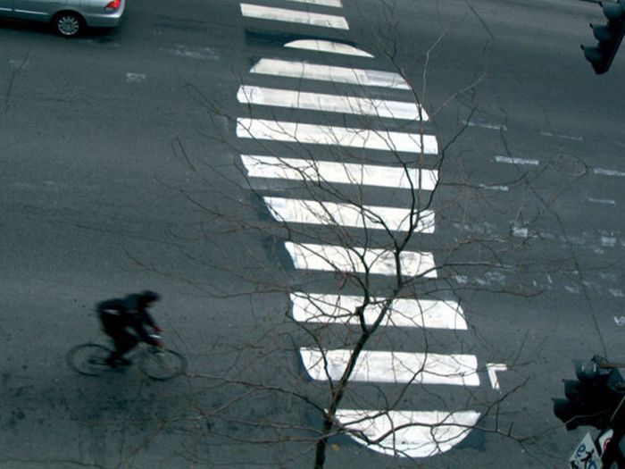 Photo of street art shoe crosswalk