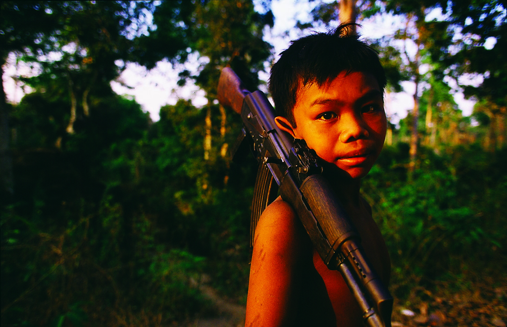 Photo of boy with AK-47 in Cambodia