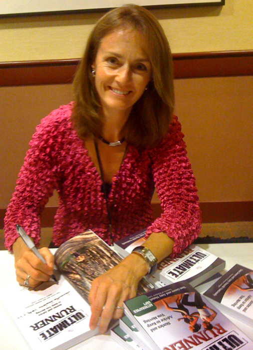 Becky Green Aaronson doing a book signing for the Ultimate Runner
