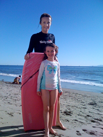 Becky Green Aaronson boogie boarding with her daughter
